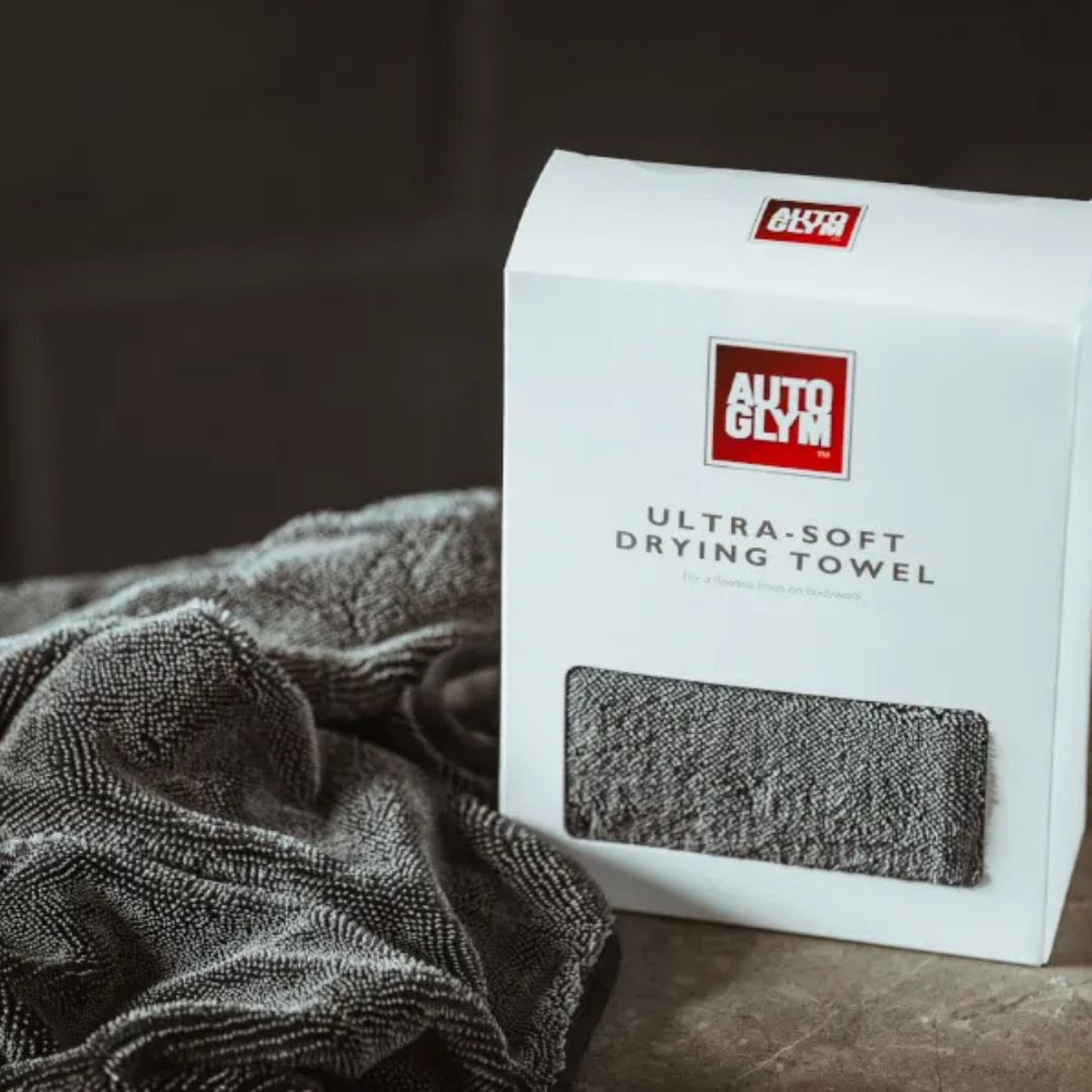 Autoglym ultra-soft drying towel packaging with a towel on a dark surface