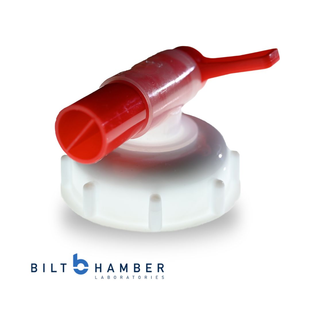 Red and white drum tap with Bilt Hamber Laboratories logo on a white background