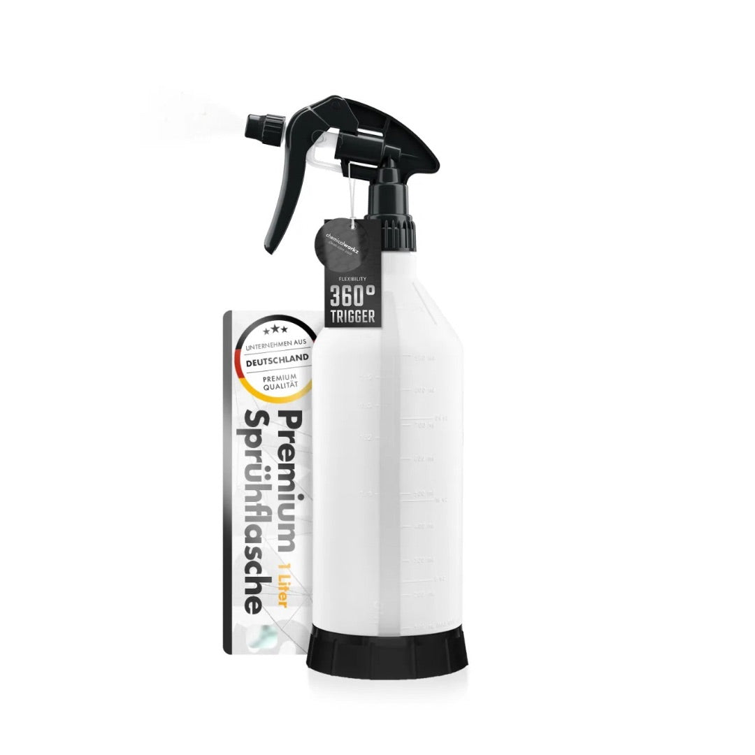 White spray bottle with black nozzle on a white background
