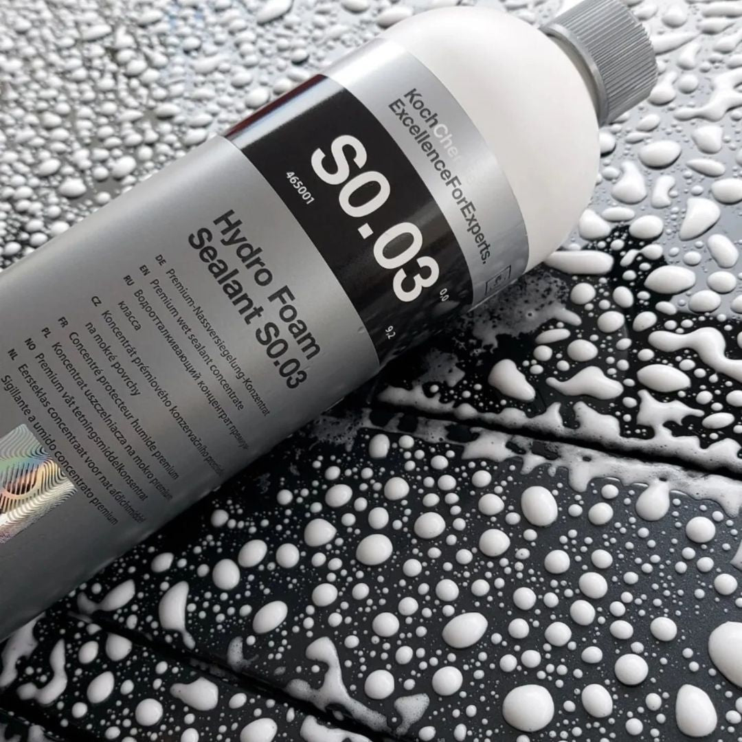 Hydro foam sealant bottle labeled SO.03 on a textured surface with water droplets.
