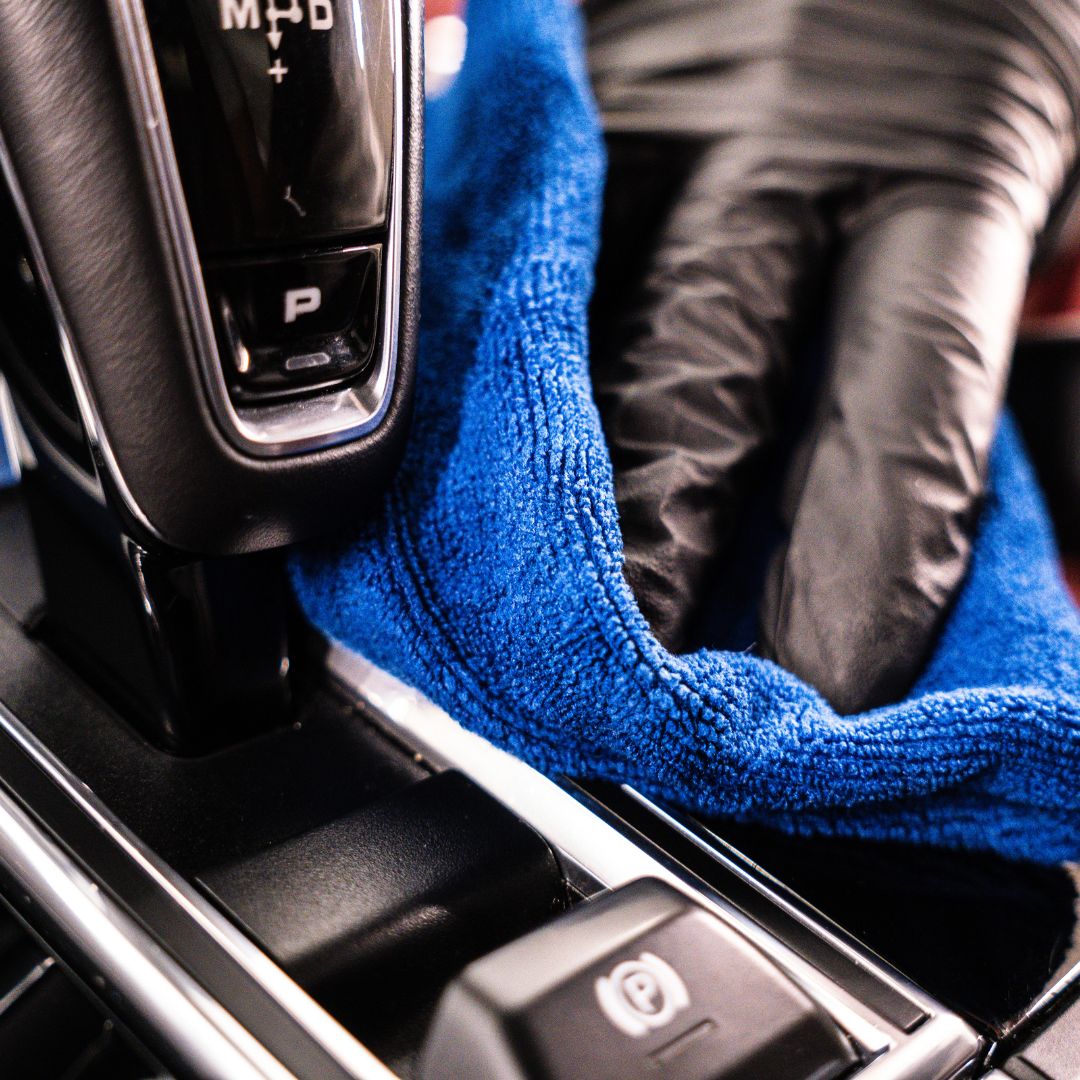 Porsche Panamera gear shift with a blue microfibre cloth wrapped around it