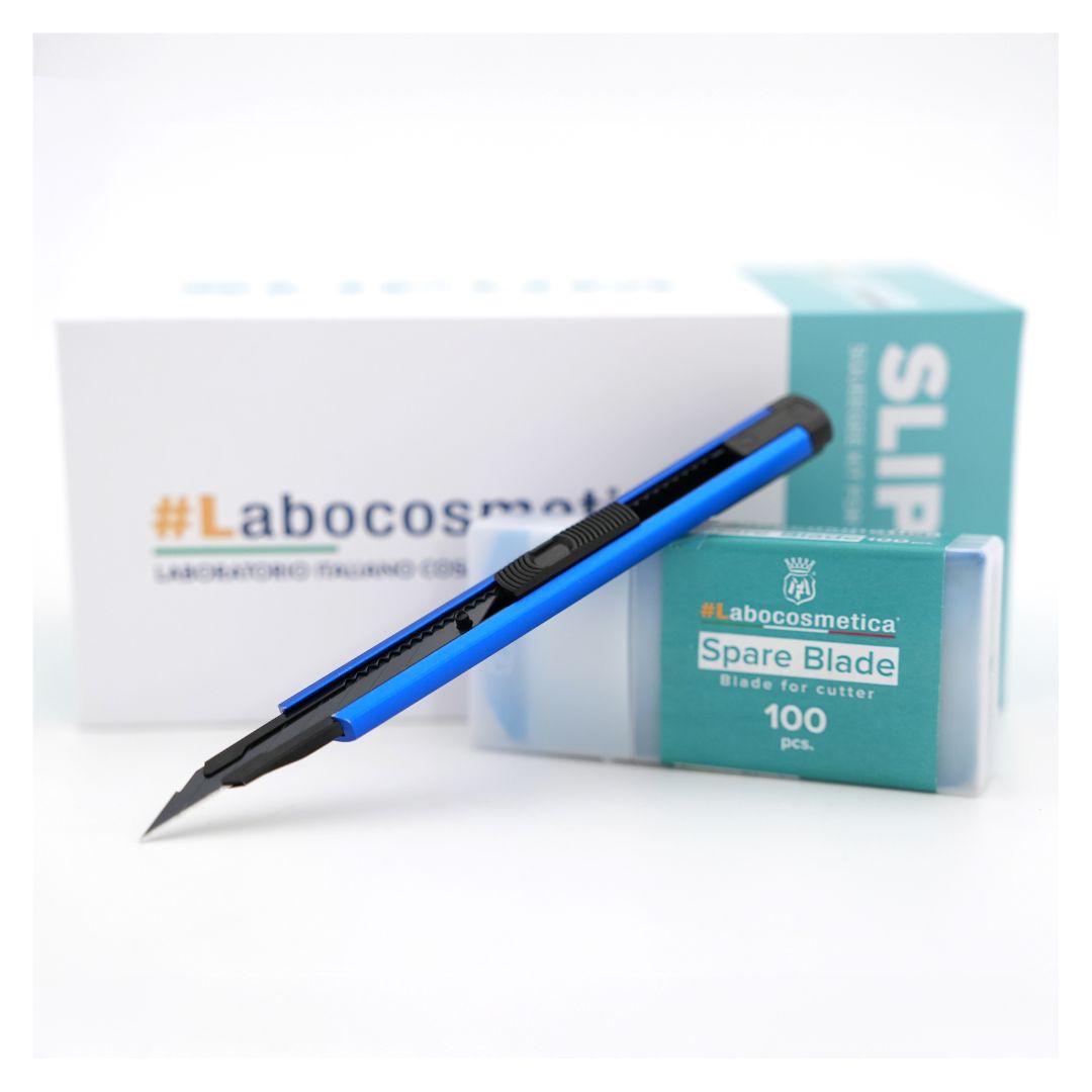 Labocosmetica PPF Cutting Knife with blue blade and black handle next to a box of spare blades on a white background.
