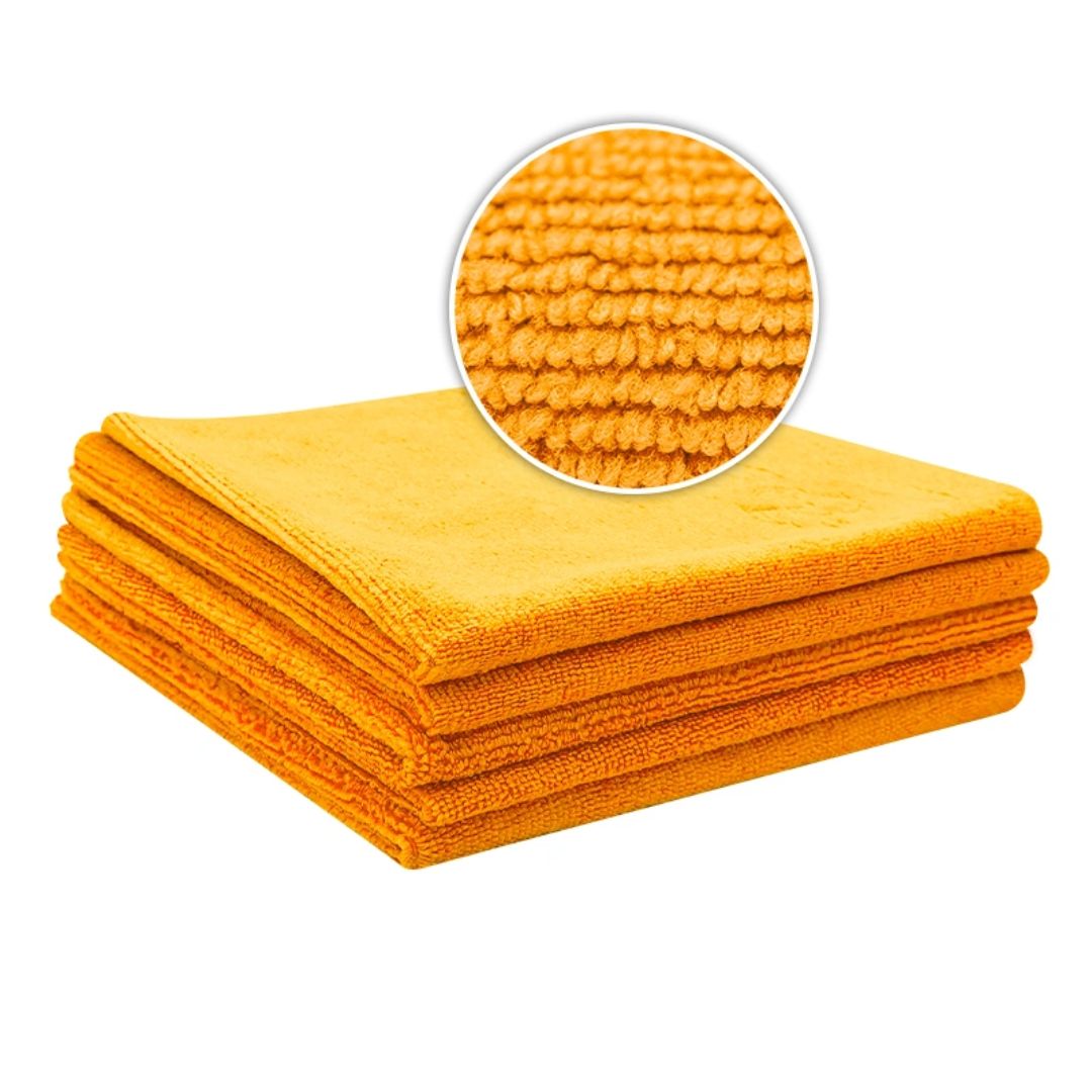 Stack of orange Liquid Elements Value microfibre cloths with a close-up of the fabric texture on a white background.