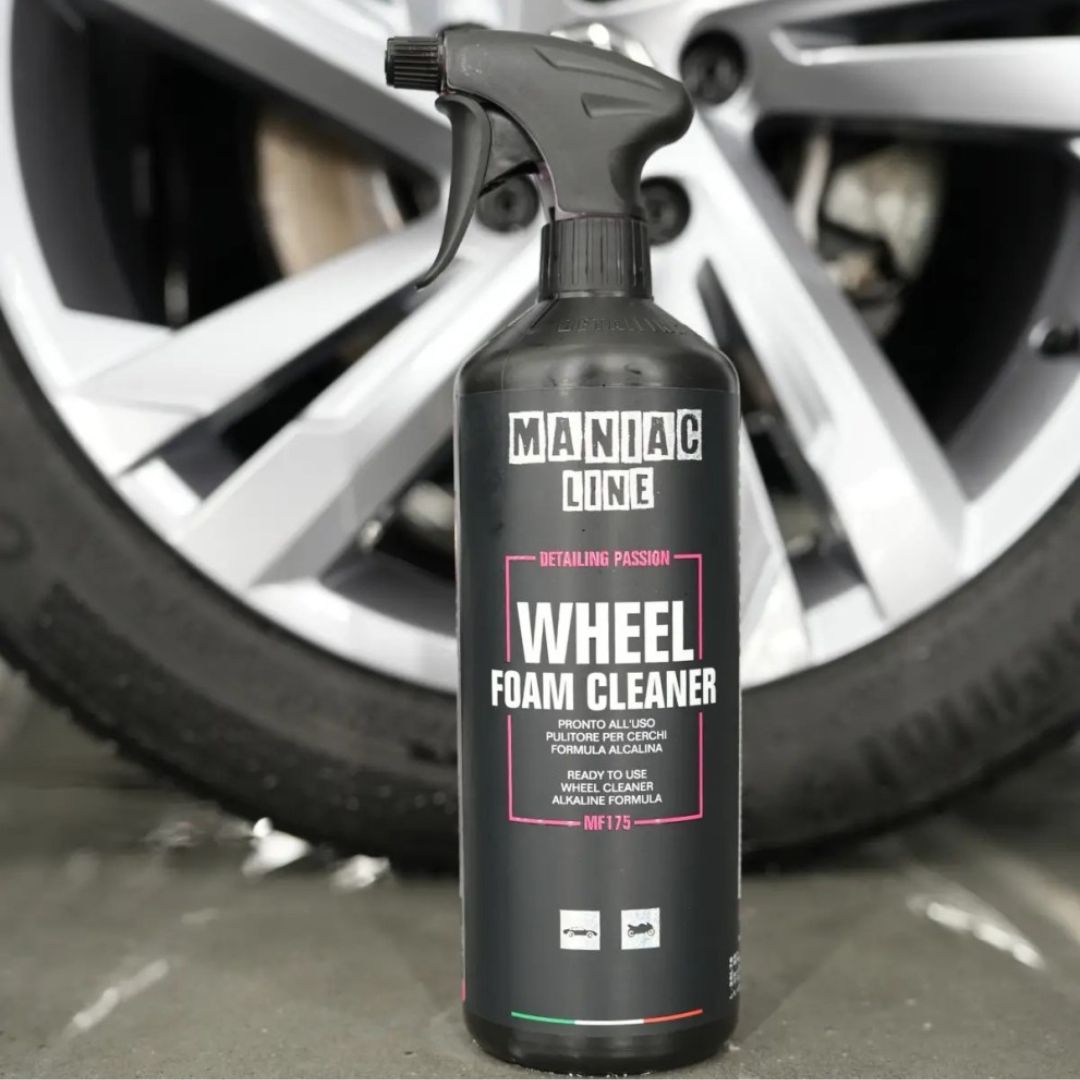 Maniac Wheel Foam Cleaner (Colour Changing) in front fo VW wheel