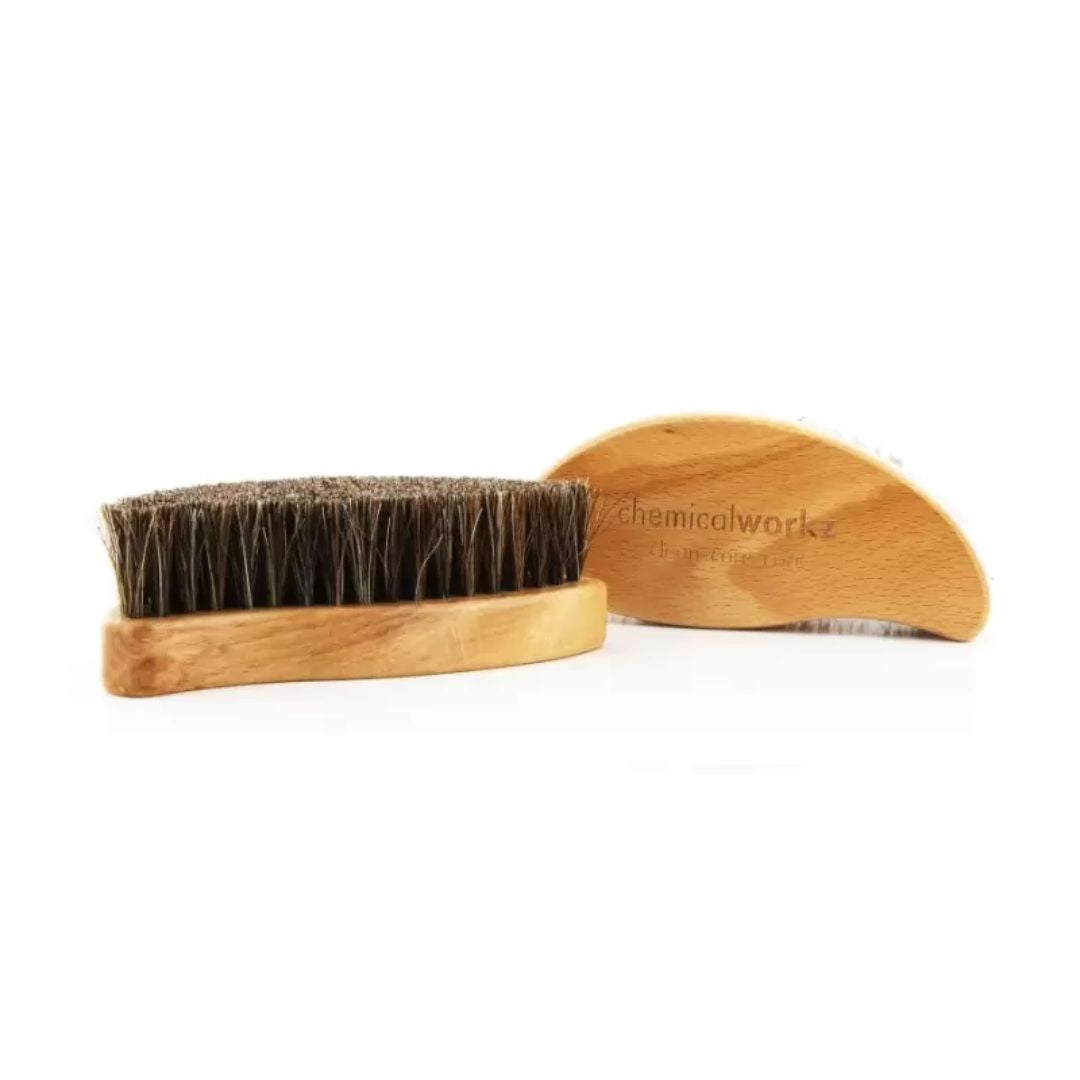 Wooden brush and wooden comb on a white background