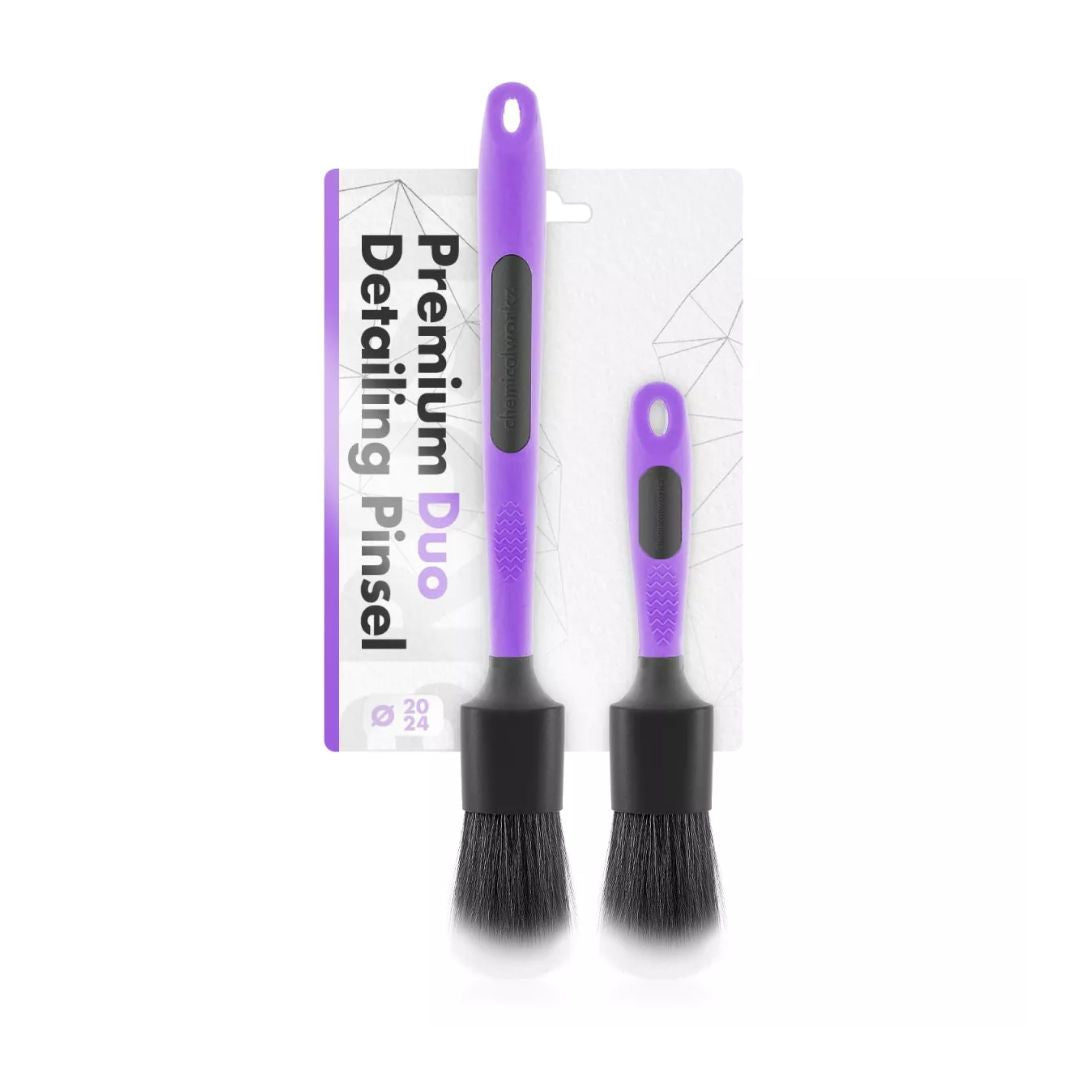 Two chemicalworkz ultra soft detailing brushes with purple handles and black bristles, accompanied by their packaging on a white background.