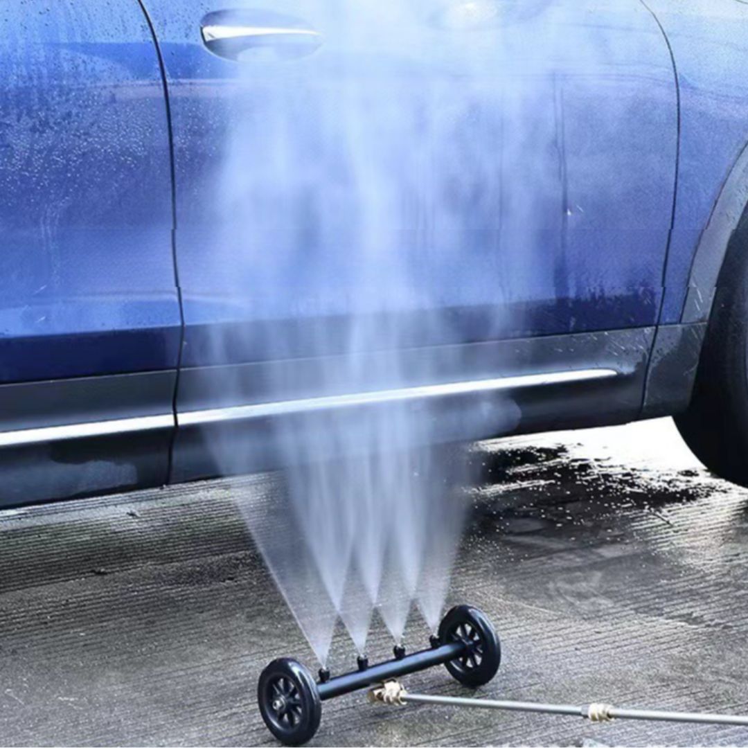 Car washing device spraying water onto a blue car