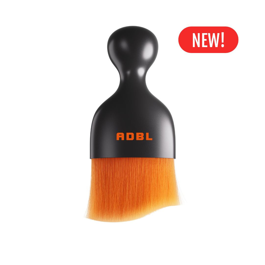 Black brush with orange bristles and 'ADBL' branding on a white background