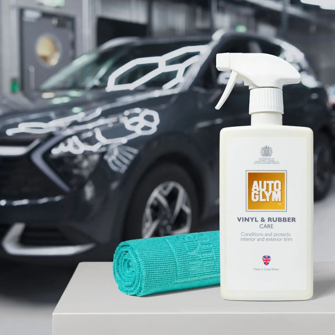 Autoglym vinyl and rubber care product with a car in the background and Autoglym All Purpose Cloth 360gsm