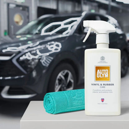 Autoglym vinyl and rubber care product with a car in the background and Autoglym All Purpose Cloth 360gsm