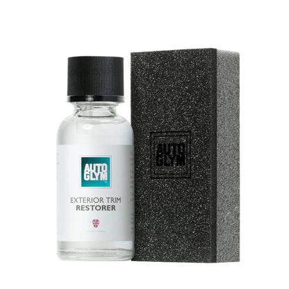Auto Glym exterior trim restorer bottle with black applicator pad on a white background