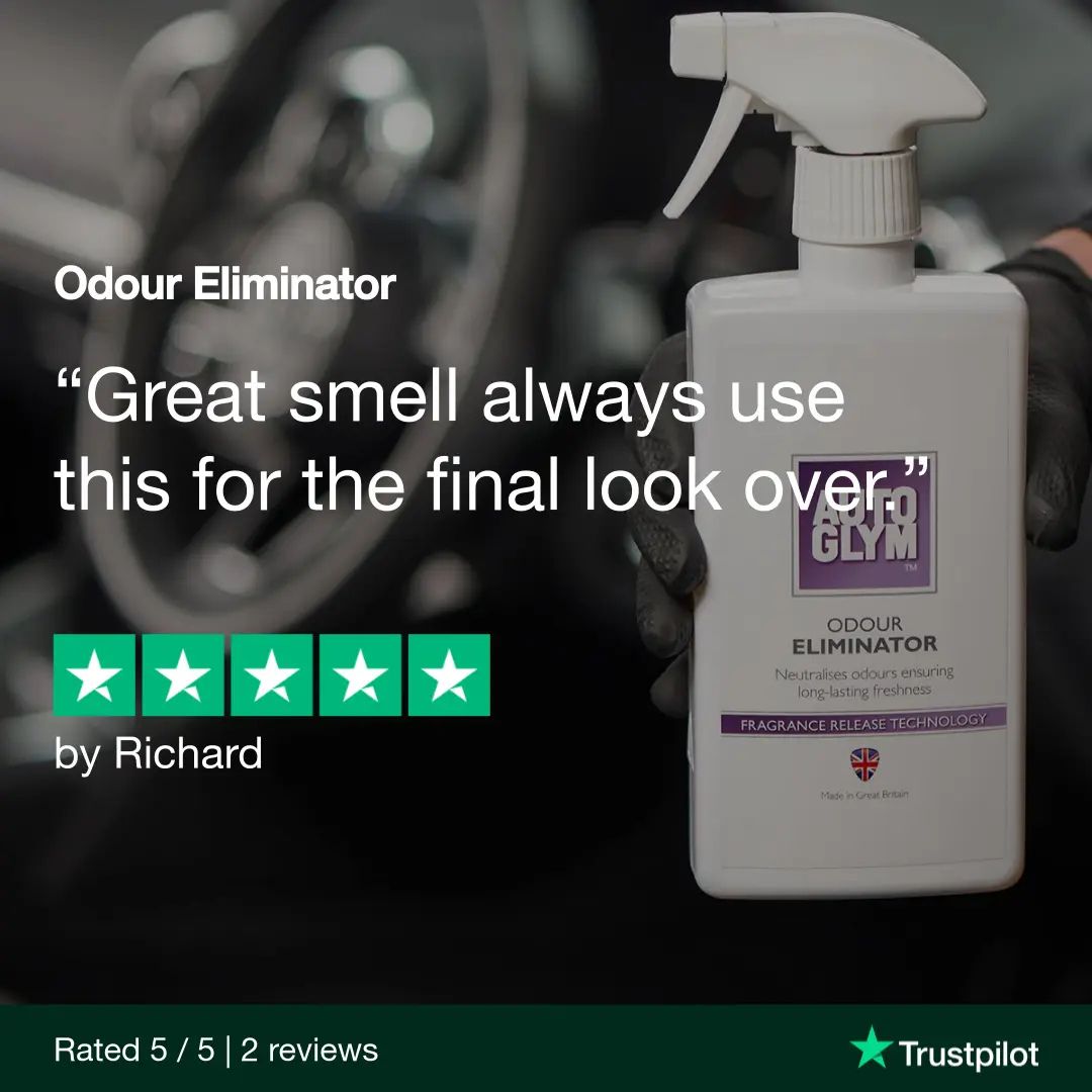 White spray bottle labeled 'Autoglym Odour Eliminator' with text and Trustpilot rating on a blurred background.