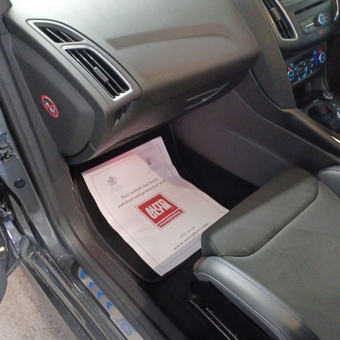 Autoglym Valet mat, paper mat in Car interior with a Ford document holder on the door panel