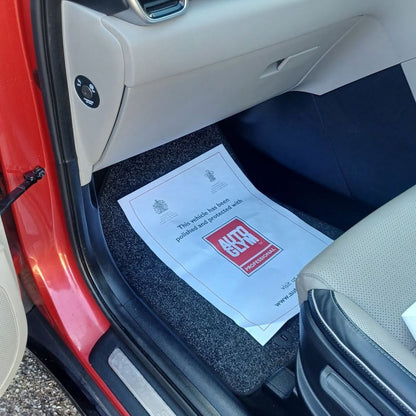 Autoglym Valet mat, paper mat in Car interior with a Ford document holder on the door panel