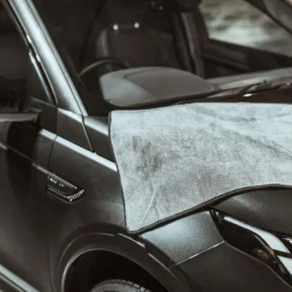 Car bonnet with an Autoglym Drying Towel draped over it, likely used for cleaning.