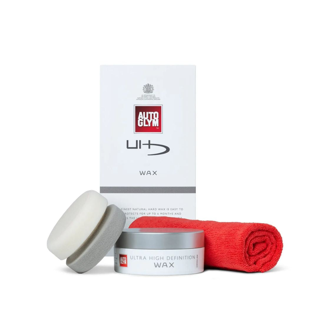 Autoglym car care products including wax, applicator, and packaging on a white background