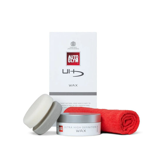 Autoglym car care products including wax, applicator, and packaging on a white background