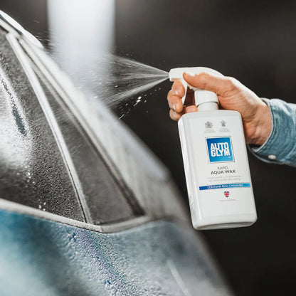 Person applying Auto Glym Aqua Wax to a car window