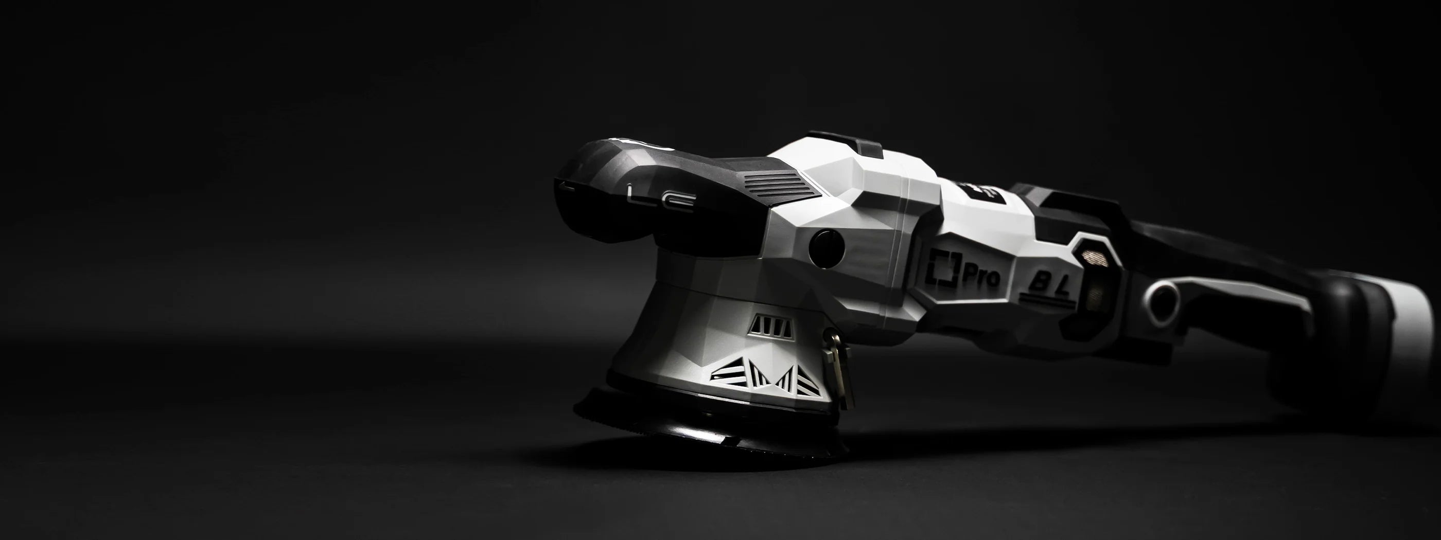 Liquid Elements A4500 Pro Black and white futuristic polishing machine on a dark background