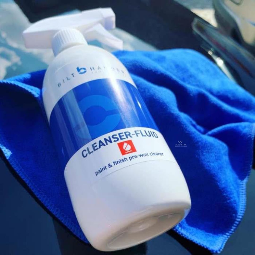 Bilt Hamon cleanser fluid bottle on a blue towel with car interior background
