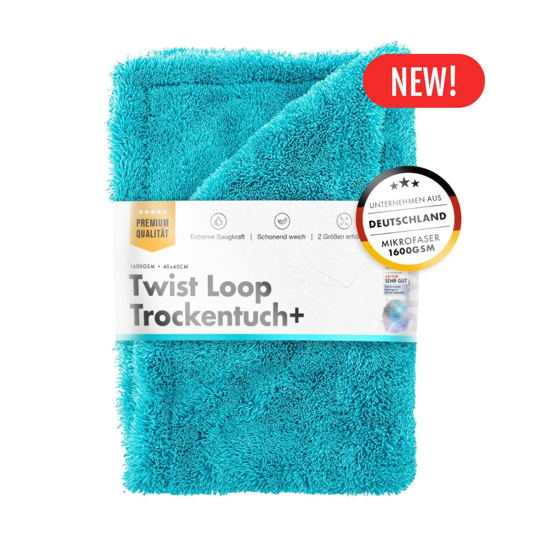 Turquoise towel with packaging labeled 'Twist Loop Trockentuch+' on a white background