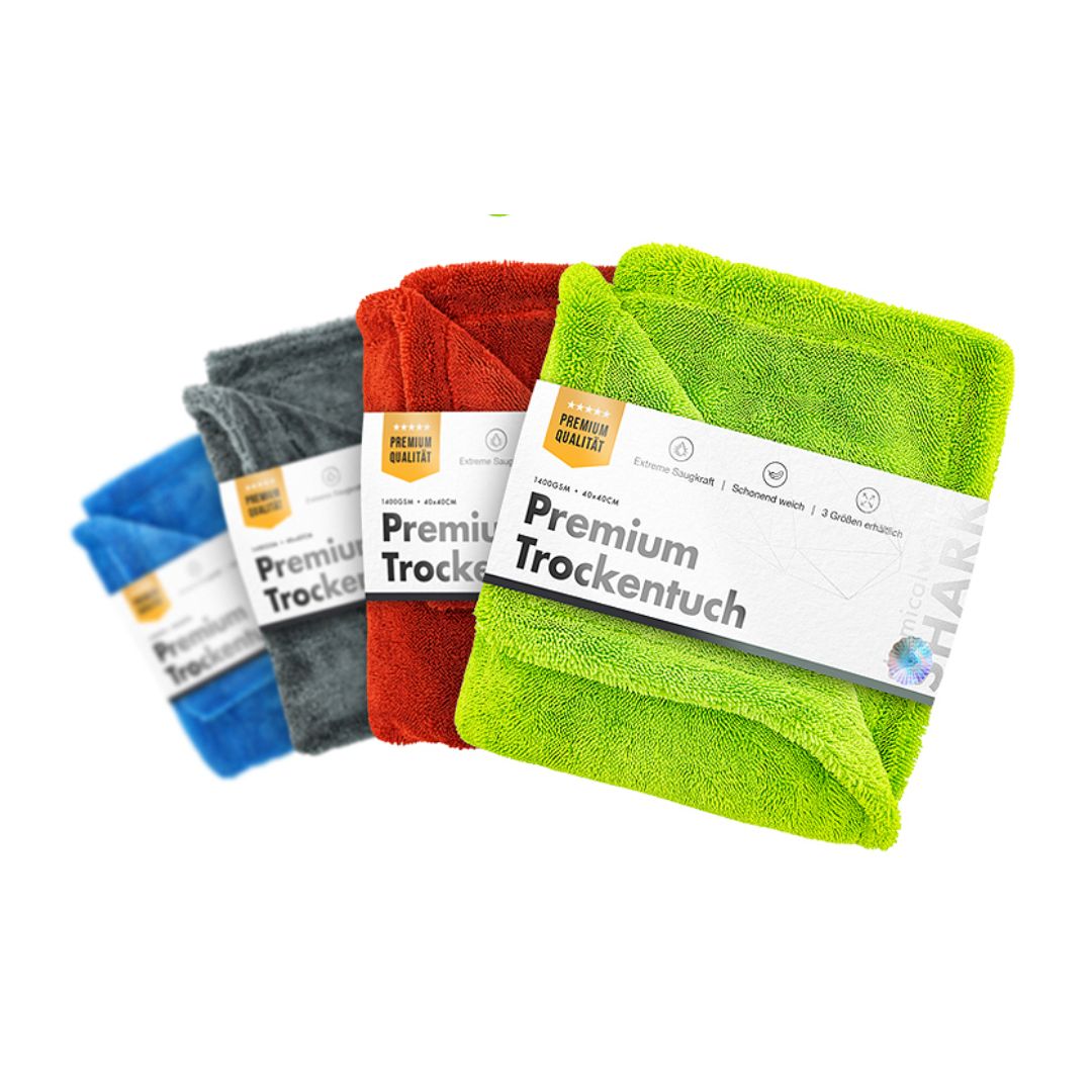 Set of colorful chemicalworkz drying towel with 1400gsm with 'Premium Trockentuch' labels on a white background