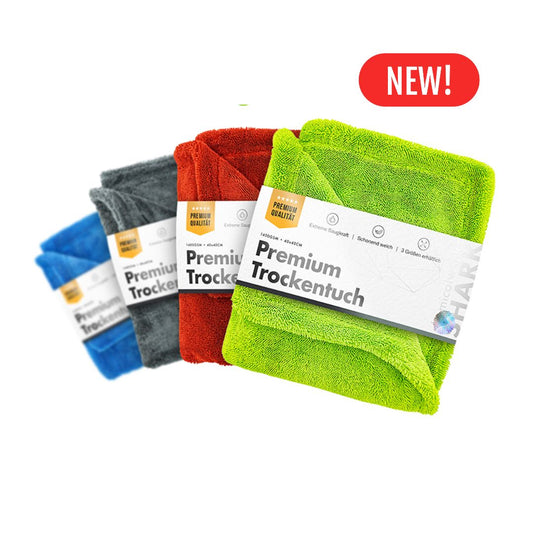 Set of colorful chemicalworkz drying towel with 1400gsm with 'Premium Trockentuch' labels on a white background