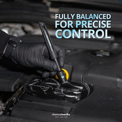 Hand wearing a black glove holding a detailing tool with text 'Fully Balanced for Precise Control' on a car interior background.