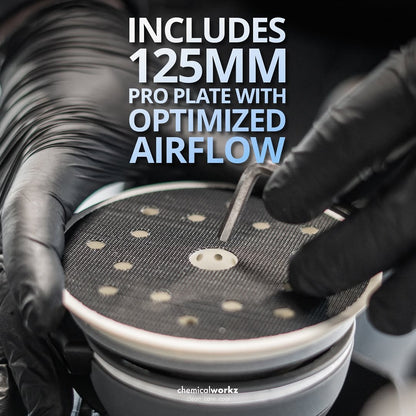 Person wearing black gloves holding a 125mm pro plate with optimized airflow, branded 'chemicalworkz'.
