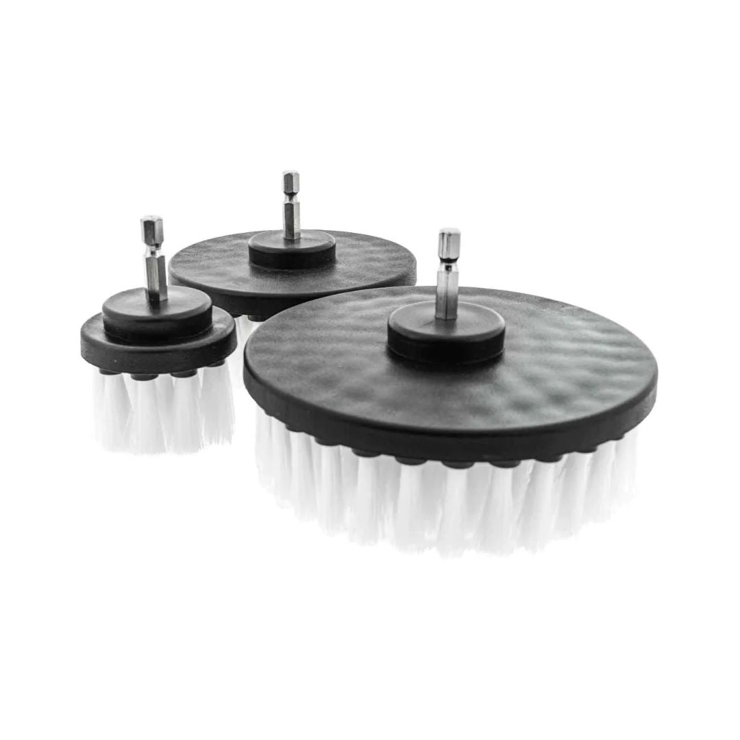 Set of three drill brush heads with varying bristle patterns on a white background