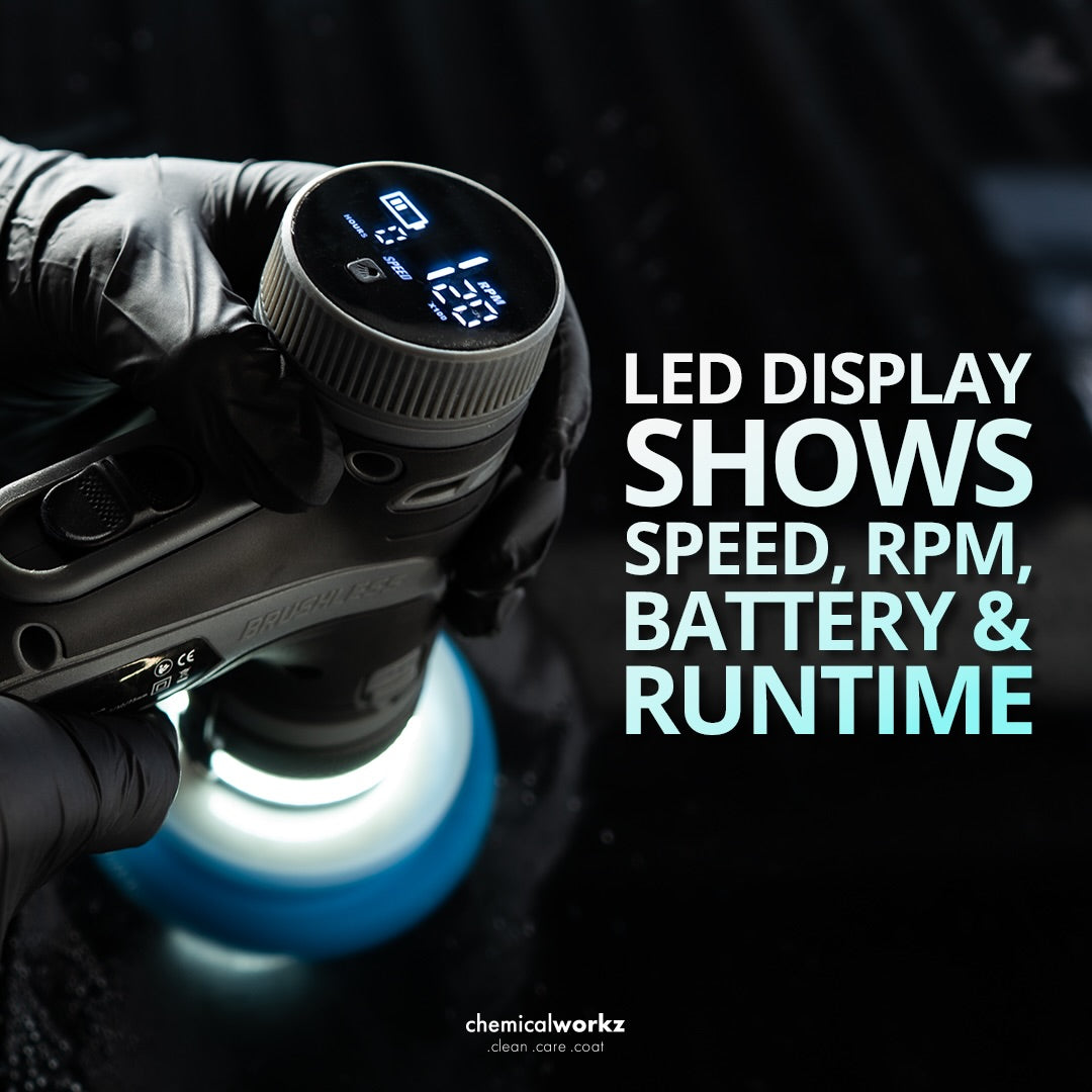 Glove holding a power tool with LED display showing speed, RPM, battery, and runtime on a dark background.