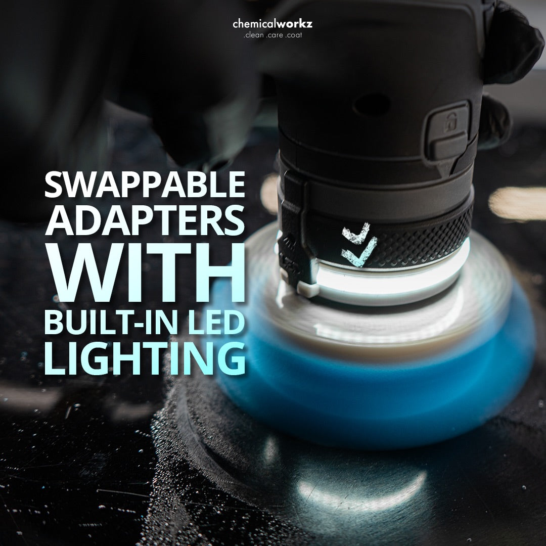 Polishing machine with swappable adapters and built-in LED lighting on a dark background.