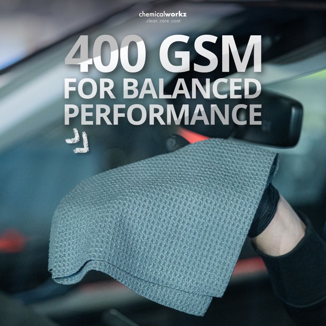 Chemicalworkz Microfibre waffle cloth with text '400 GSM FOR BALANCED PERFORMANCE' held by a person inside a car.