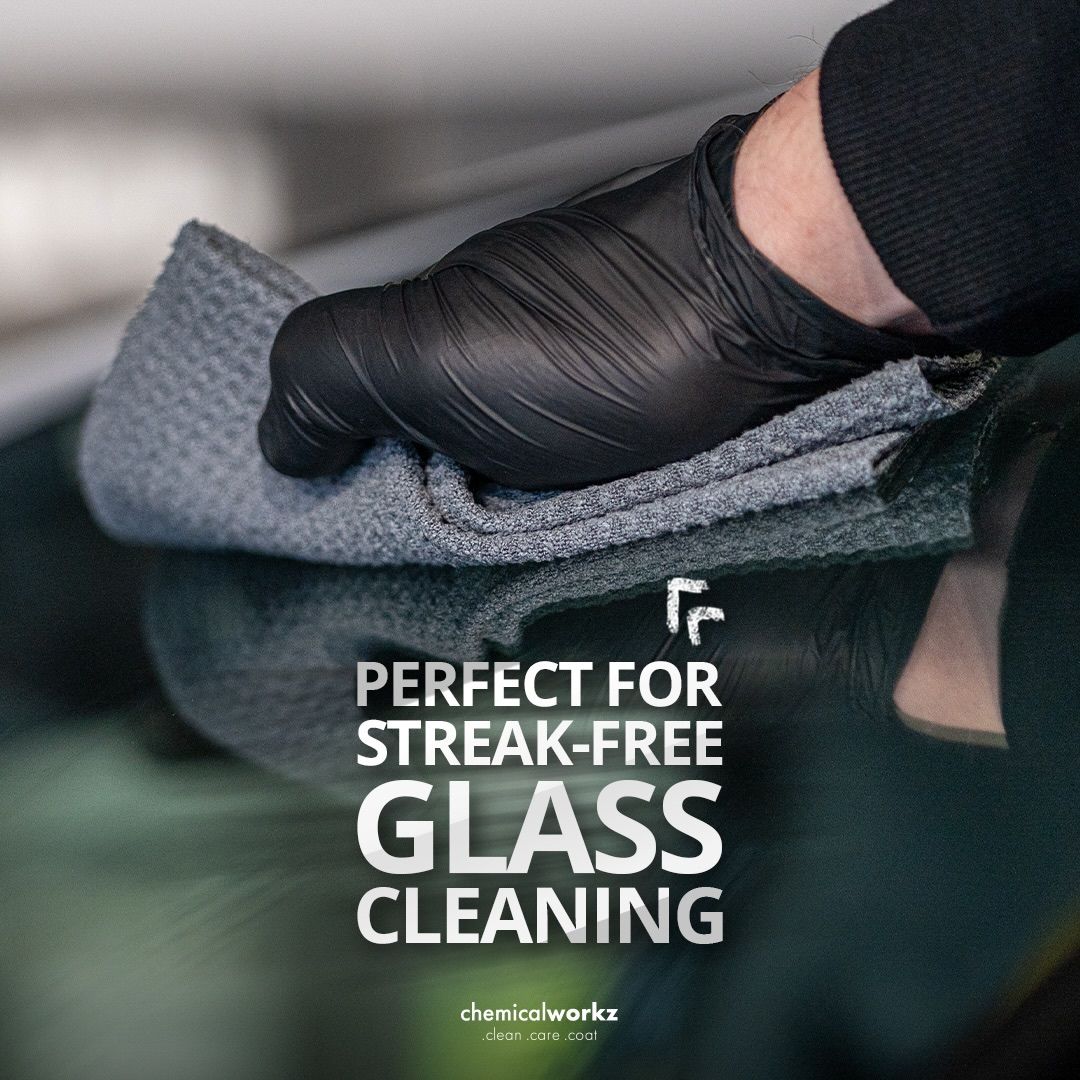 Person cleaning a car window with a microfibre waffle cloth and text 'Perfect for Streak-Free Glass Cleaning' by Chemicalworkz.