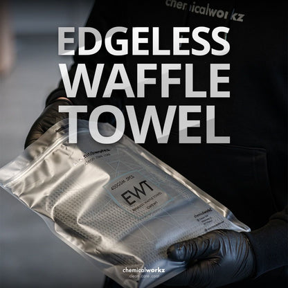 Packaged edgeless waffle cloth held by a gloved hand with 'Chemicalworks' branding.