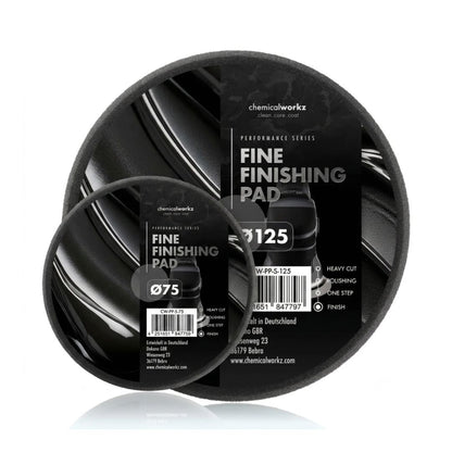 Two black fine finishing pads with labels on a white background