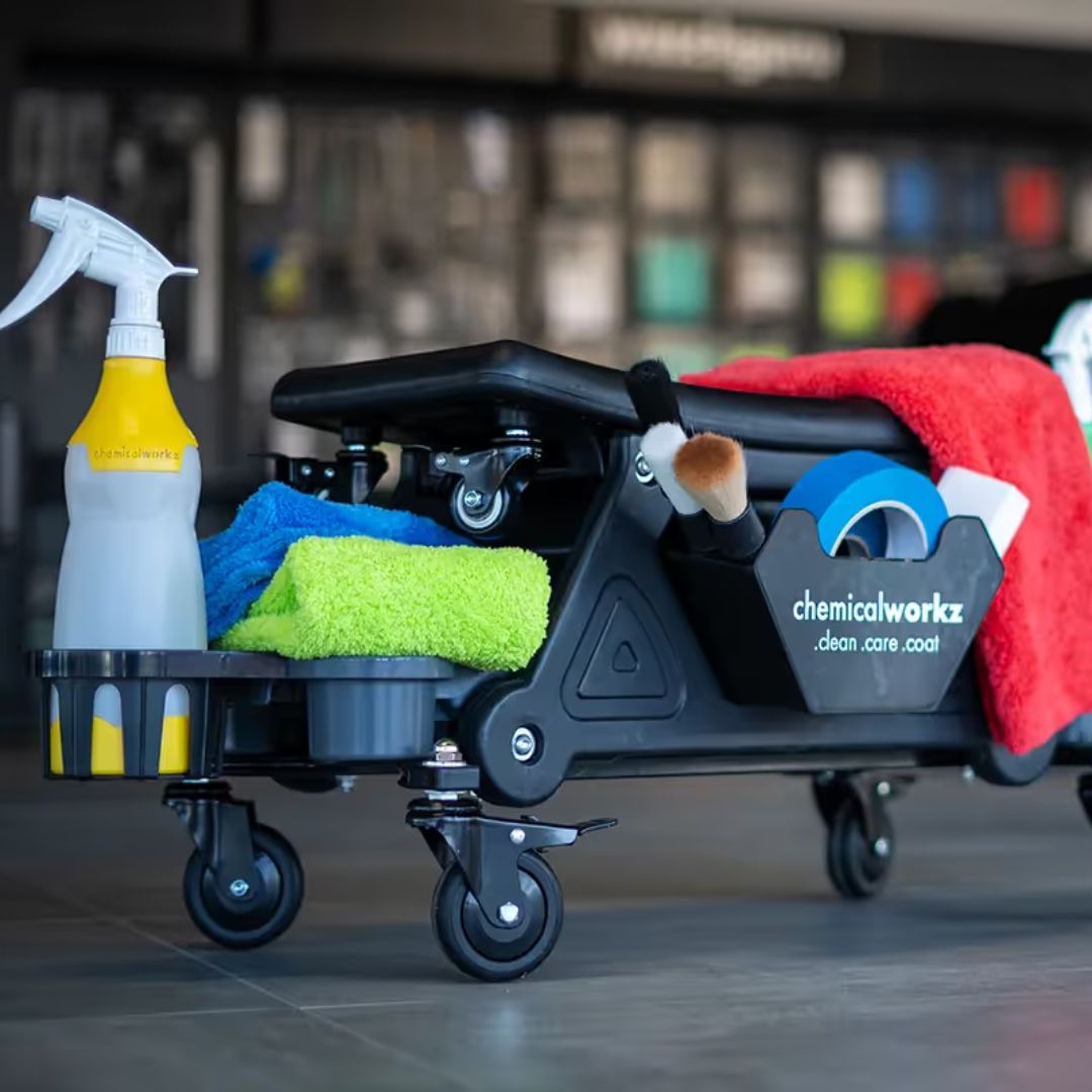 Cleaning cart with supplies including a spray bottle, cloths, and a brush, branded 'chemicalworkz'.