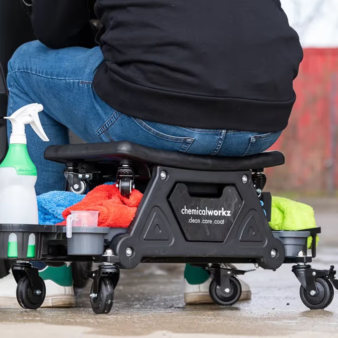 Person using a ChemicalWorks cleaning cart with various cleaning supplies.
