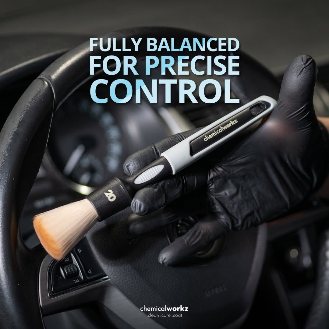 Hand holding an ulta soft Chemicalworkz detailing brush with text 'Fully Balanced for Precise Control' over a car interior background.