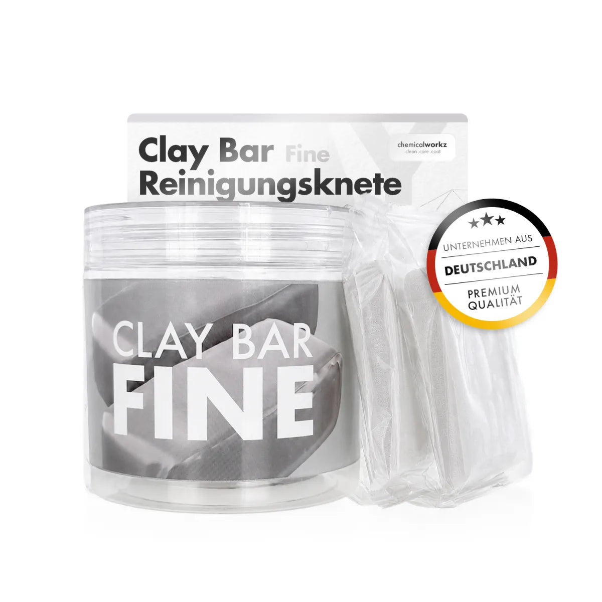 Chemicalworkz Magic Clay Bar  A clear plastic jar of Clay Bar Fine Reinigungsknete cleaning clay bars next to a sealed packet of individual clay bars, with the product packaging box behind it and a circular 'Deutschland Premium Qualität' badge on the right.