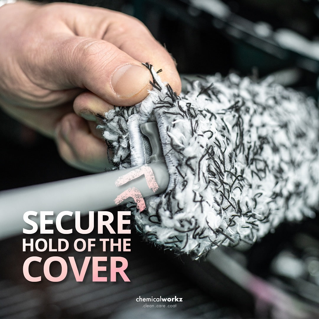 Hand holding a wheel brush with text 'Secure Hold of the Cover' and brand name 'chemicalworkz'.