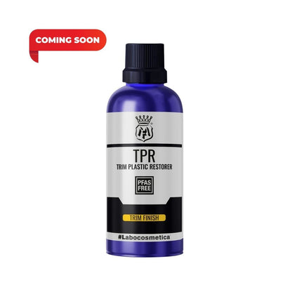 A blue bottle of Labocosmetics TPR Trim Plastic Restorer with a black cap and white/black label, featuring a red 'COMING SOON' badge in the top left corner.