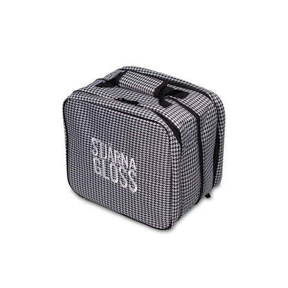 Black and white checkered bag with 'Stjarna Gloss' branding on a white background