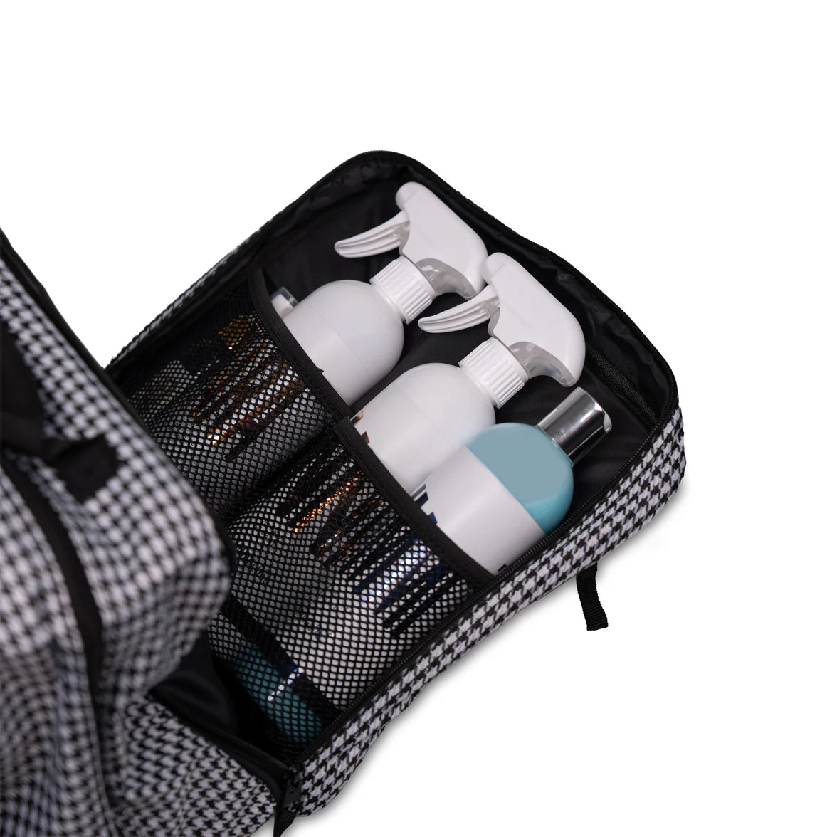 Black toiletry bag with white bottles and a blue cap on a white background