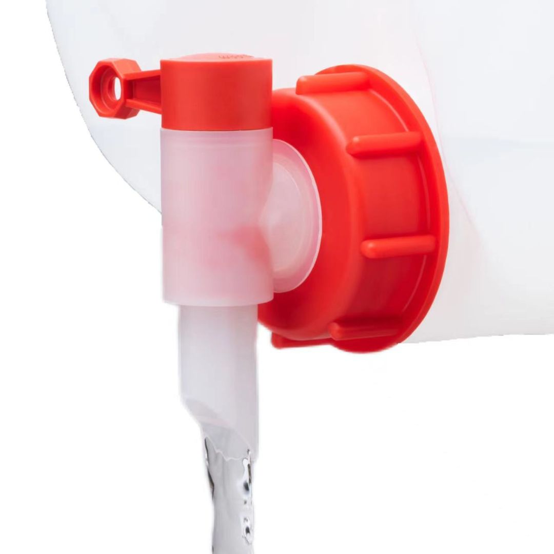 Close-up of a red and white plastic pump on a white background