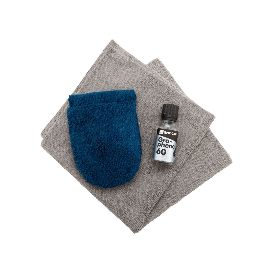 Blue finger applicator on grey fabric with a bottle labeled 'Graphene 60' on a white background