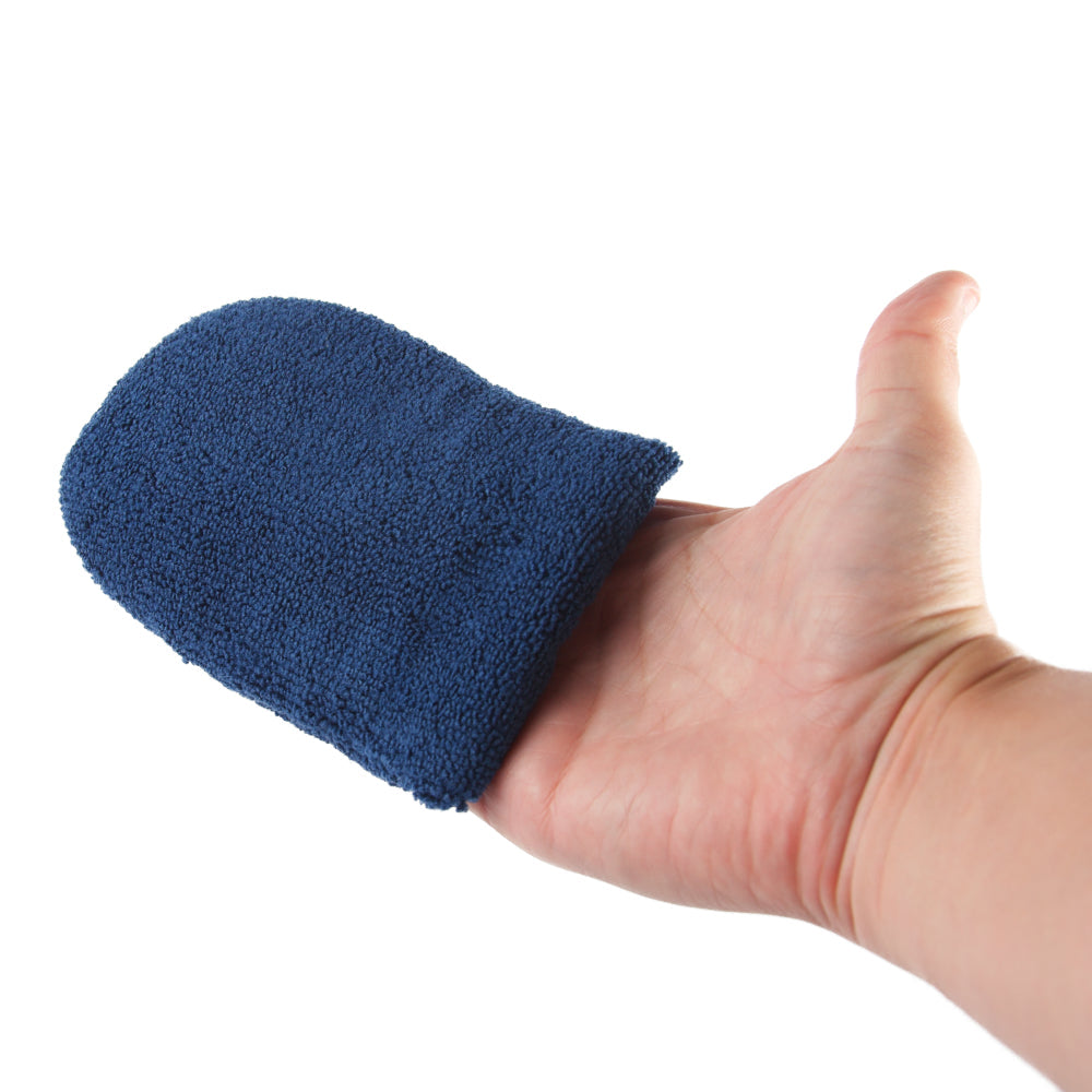 Hand wearing a blue EWOCAR applicator mitt on a white background