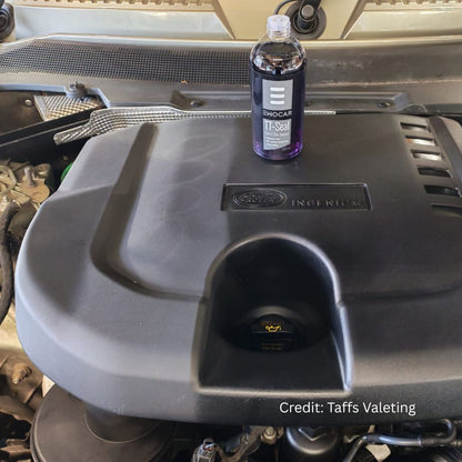 Bottle of plastic sealant on a land rover engine cover with 'Taffs Valeting' credit.