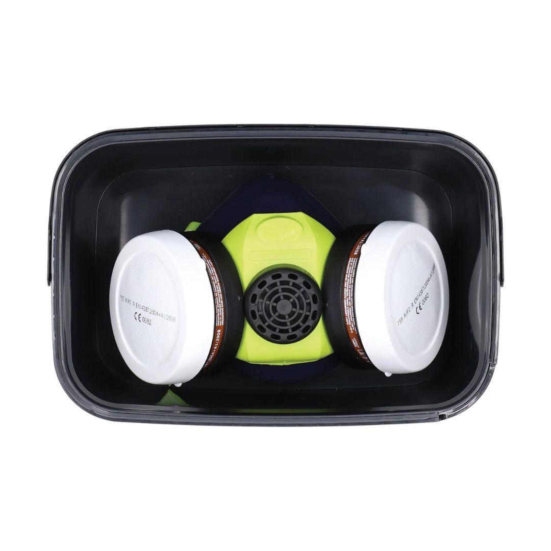 A two-piece respirator mask with a bright lime green central facepiece, black filter cartridges, and a black plastic storage container, shown from a top-down view on a white background.