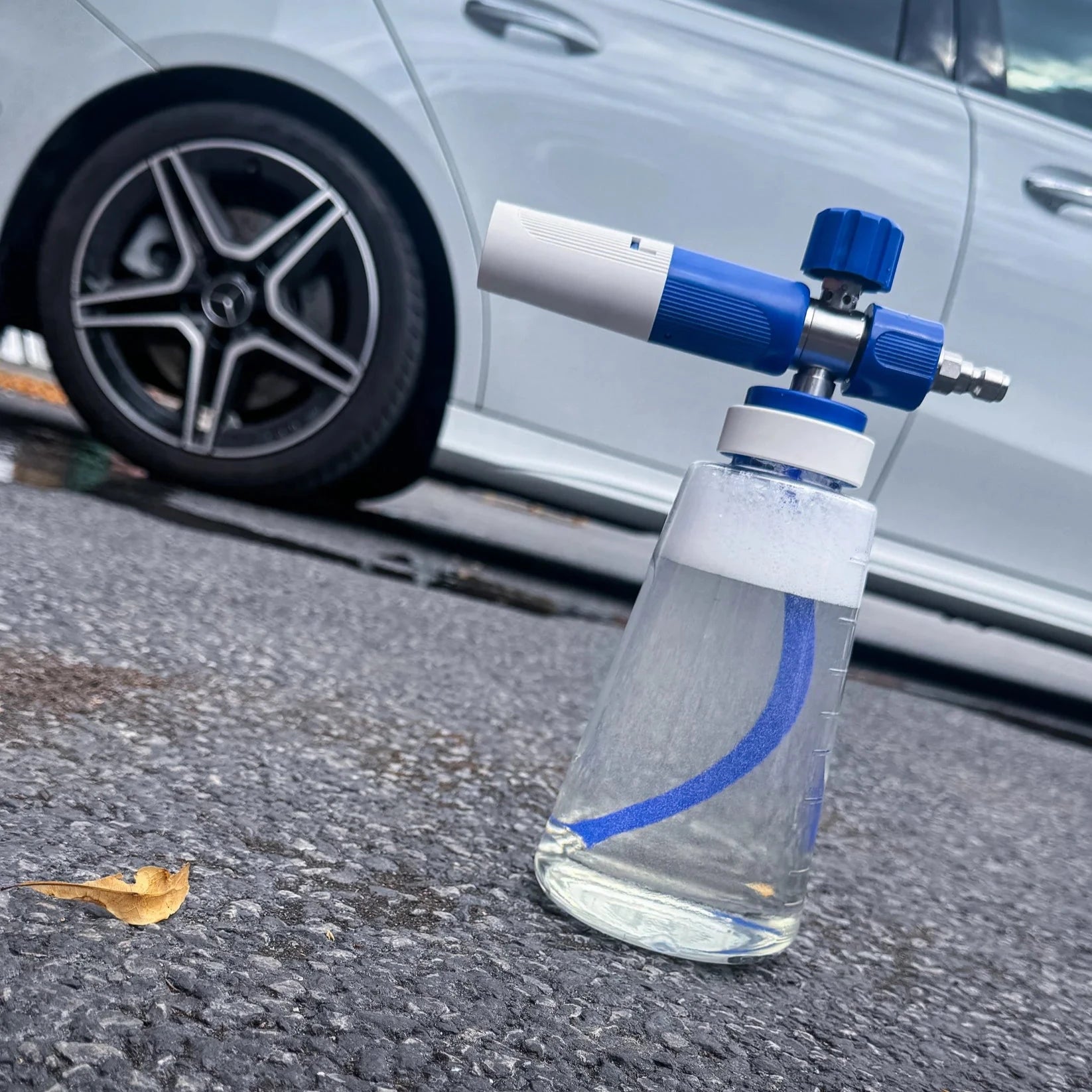 Car air freshener with blue and white design on a car's side mirror